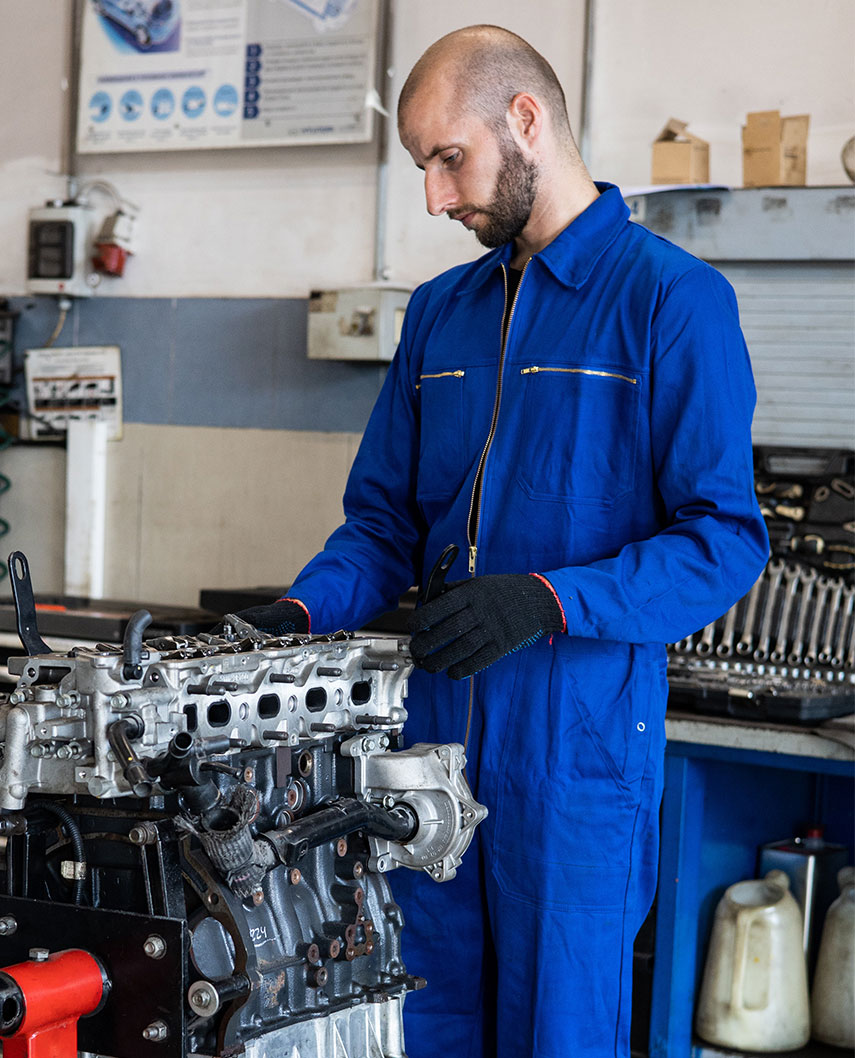Mechanic Working on Engine Mechanic Working on Diesel Motor